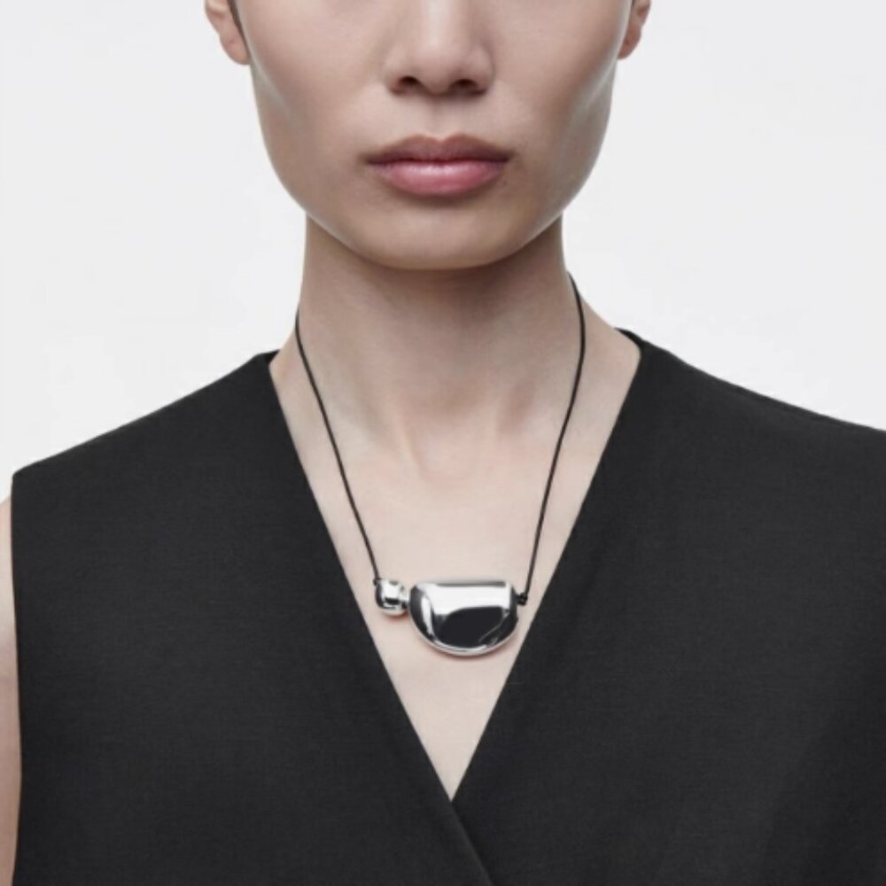 COS Polished Silver Sculptural Pendant Necklace with Black Cord